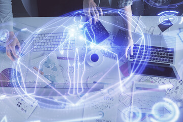 Double exposure of man and woman working together and education theme hologram drawing. Computer background.