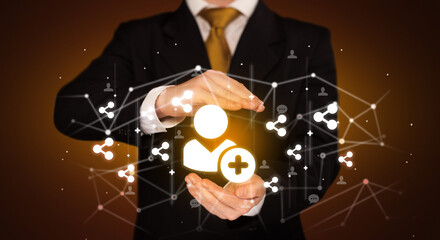 Hand holding social media icons