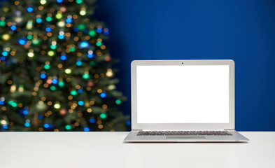 Laptop mockup template with empty screen against christmas lights