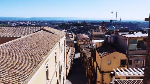 Aerial view of an old Italian city, drone flying between buildings, Caltagirone, Sicily, Italy