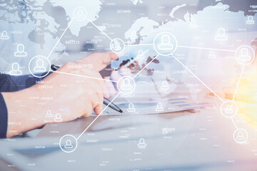 Double exposure of man's hands holding and using a phone and social network theme drawing.