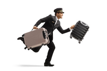 Full length profile shot of a bellboy running and carrying suitcases