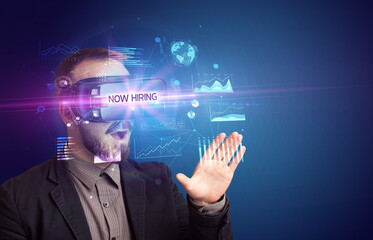 Businessman looking through Virtual Reality glasses