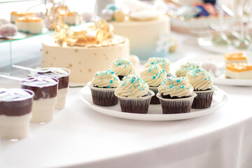 selective focus. Tasty candy bar for Birthday party on table against color background. High quality photo