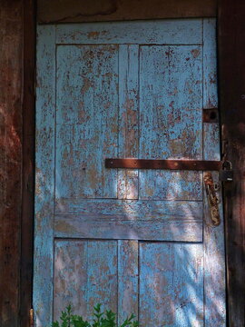 Blue Crooked Wooden Door