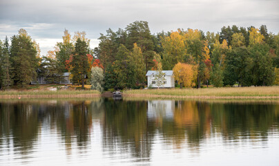 Country house in the forest in the lake. Autumn season Kuopio Finland