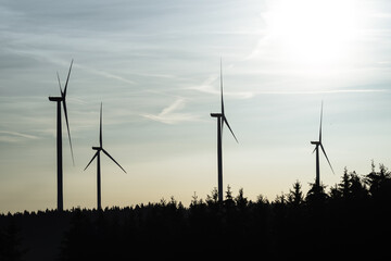 Wind turbine in the sunrise seen from an aerial view