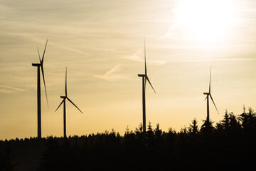 Wind turbine in the sunrise seen from an aerial view