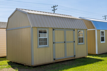 Fototapeta na wymiar Storage shed made of wood for gardening tools equipment