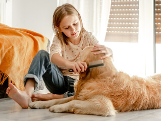 Girl with golden retriever dog