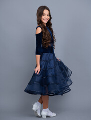 Fototapeta premium Full length of teenager child wearing ball dress. Happy girl face, positive and smiling emotions.