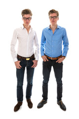 Male twins with white and blue blouse standing together
