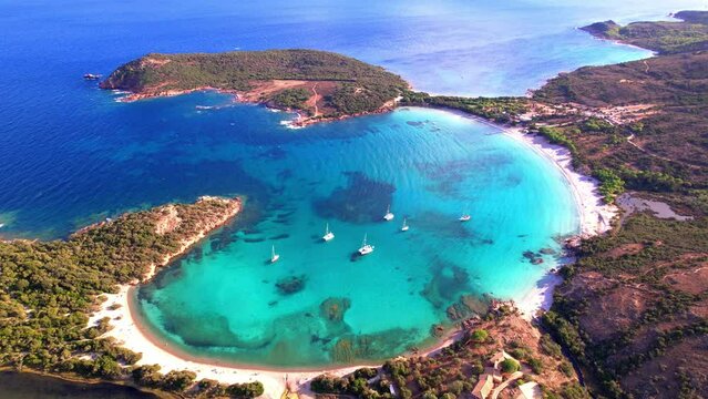 Rondinara Beach Aerial: Perfect Shell-Shaped Bay with Turquoise Lagoon and White Sand. Iconic Drone View of Corsica's Best Beach, Mediterranean Sea, France