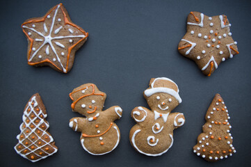 Set of different homemade Christmas cookies isolated on background, close up view with copy space for text. New year frame with tasty gingerbread cookies with spices. Winter holiday concept