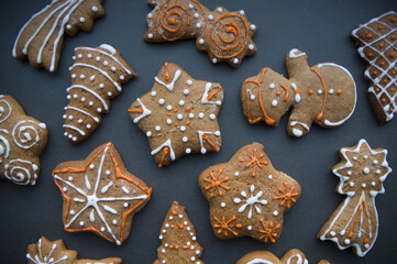 Set of different homemade Christmas cookies isolated on background, close up view with copy space for text. New year frame with tasty gingerbread cookies with spices. Winter holiday concept