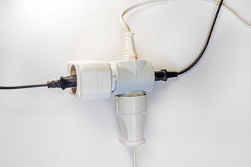 white adapter with included wires on a light background, horizontal