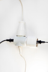 white adapter with included wires on a light background