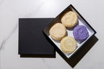 Handmade soap in a gift box. Place for text. Decorative cosmetics.