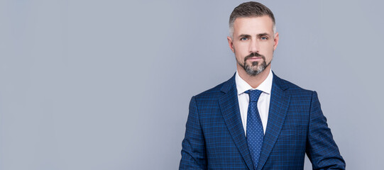 confident businessman man in businesslike suit, success. Man face portrait, banner with copy space.