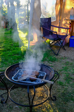 Burgers Being Cooked With A Disposable BBQ