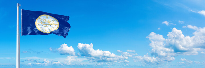 Obraz na płótnie Canvas Aurora - USA, flag waving on a blue sky in beautiful clouds - Horizontal banner