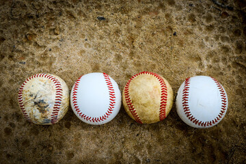 Dirty baseballs on a field in a park in Central Florida