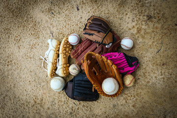 Close-up of Baseball Equipment including baseball gloves, balls, cleats and bats at park in Central Florida