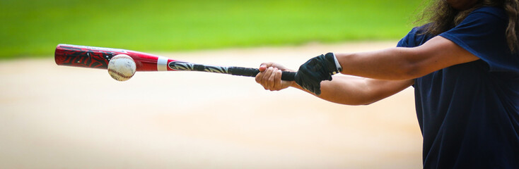 Close-up of Baseball Equipment including baseball bat and batting glove at park in Central Florida