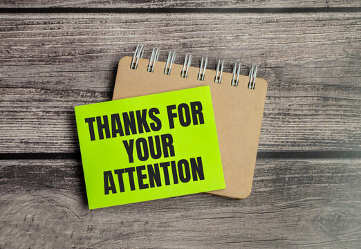 Thank You For Your Attention words on green sticker on wooden background