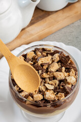 Dessert in the glass. Pastry cream dessert with chocolate ganache.