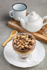 Dessert in the glass. Pastry cream dessert with chocolate ganache.