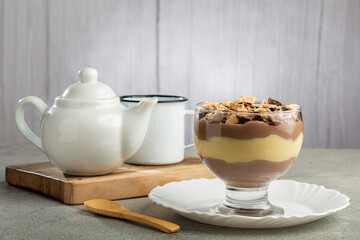 Dessert in the glass. Pastry cream dessert with chocolate ganache.