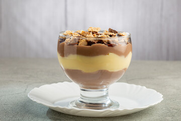 Dessert in the glass. Pastry cream dessert with chocolate ganache.