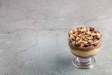 Dessert in the glass. Pastry cream dessert with chocolate ganache.