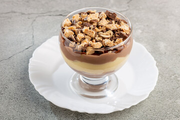 Dessert in the glass. Pastry cream dessert with chocolate ganache.