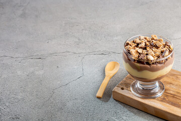 Dessert in the glass. Pastry cream dessert with chocolate ganache.