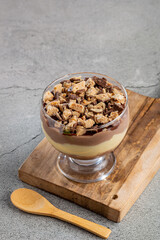 Dessert in the glass. Pastry cream dessert with chocolate ganache.