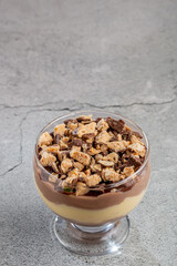 Dessert in the glass. Pastry cream dessert with chocolate ganache.