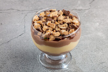 Dessert in the glass. Pastry cream dessert with chocolate ganache.