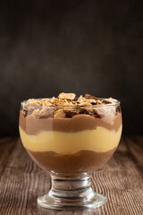 Dessert in the glass. Pastry cream dessert with chocolate ganache.