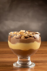 Dessert in the glass. Pastry cream dessert with chocolate ganache.