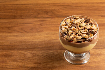 Dessert in the glass. Pastry cream dessert with chocolate ganache.