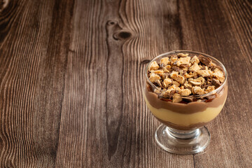 Dessert in the glass. Pastry cream dessert with chocolate ganache.