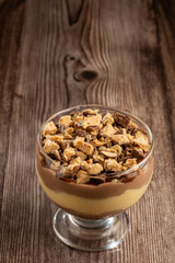 Dessert in the glass. Pastry cream dessert with chocolate ganache.