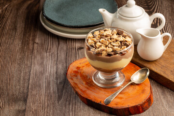 Dessert in the glass. Pastry cream dessert with chocolate ganache.