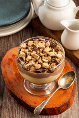 Dessert in the glass. Pastry cream dessert with chocolate ganache.