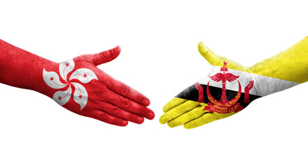 Handshake between Brunei and Hong Kong flags painted on hands, isolated transparent image.