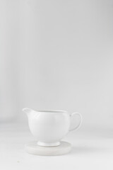 Ceramic milk jug, milk jug on a marble coaster