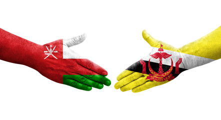 Handshake between Brunei and Oman flags painted on hands, isolated transparent image.