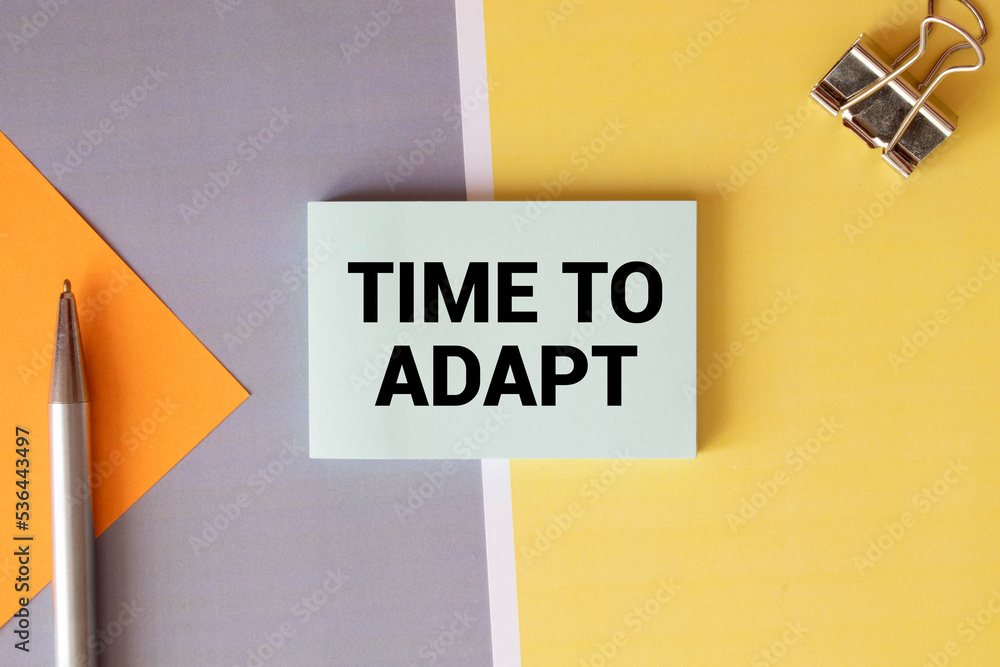 Poster card with text time to adapt on charts and notepads